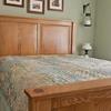 Blyth Bed
Craftsman style bed with raised inset panels in white oak Queen 
